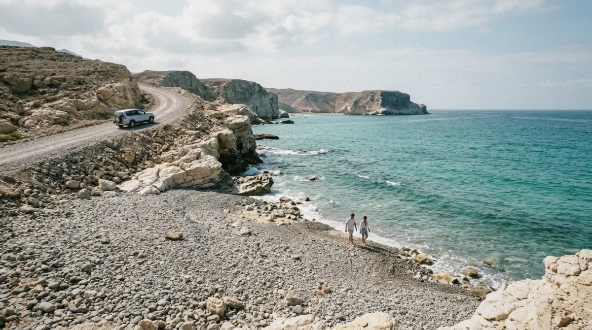 White limestone rocks and a pebble beach on the turquoise Gulf of Oman shore near Fins